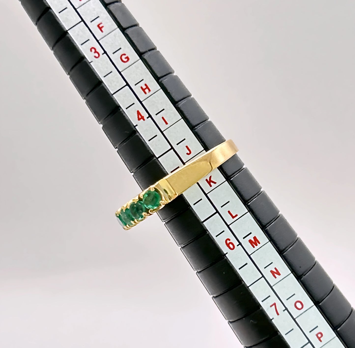 NZGD | 18ct Gold Emerald Horizon BandValuation $4,050