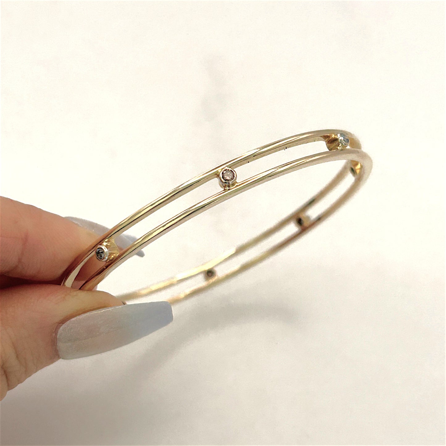 NZGD | 15ct Gold Aureline Dual‑Arc Bangle Valuation $11,000